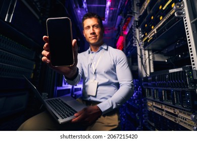 IT Professional Posing For Camera In Server Room