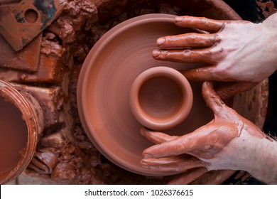 Professional potter making bowl in pottery workshop, studio. - Shutterstock ID 1026376615