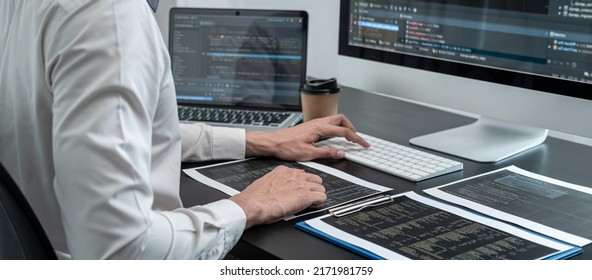 Professional programmer working on website project in software development on the desktop computer, making coding and typing data code password security. - Shutterstock ID 2171981759
