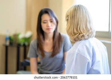 Professional Psychiatrist Listening To Her Patient In Medical Clinic Or Hospital Mental Health Service