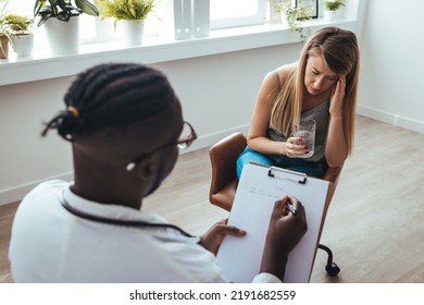 Professional Psychotherapies And Young Woman Suffering From Ptsd. A Young Girls Meets With A Therapist To Discuss Her Struggles, Addictions And Mental Well Being. Doctor In Consultation Female Patient