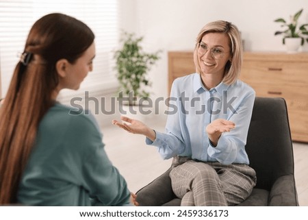 Professional psychotherapist working with patient in office