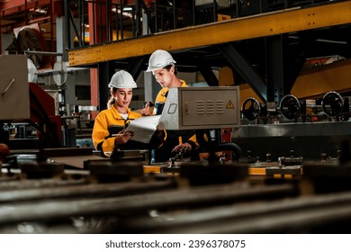 Professional quality control inspector conduct safety inspection on steel machinery and manufacturing process. Factory engineer or operator make optimization in heavy industry facility. Exemplifying - Shutterstock ID 2396378075