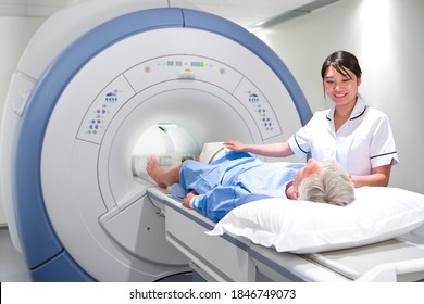 A professional radiologist in uniform helping a senior adult with the MRI scanning process in a clinic