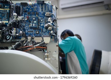 Professional Repair Service Man Of CT Scan In Hospital. Bangkok Thailand.