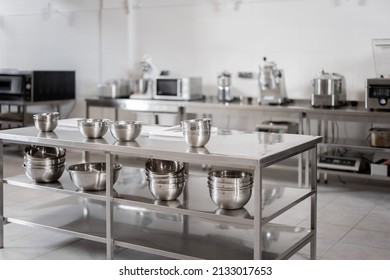 Professional Restaurant Kitchen With Kitchen Equipment And Stainless Steel Tables. Interior With No People