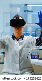 Professional Scientist Wearing Virtual Reality Glasses Using Medical Inovation In Lab. Team Of Researchers Working With Equipment Device, Future, Medicine, Healthcare, Professional, Vision, Simulator