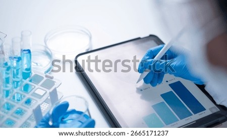 Professional scientist working writing experiment research results on tablet document for data analysis chemist hospital new discovery in genetic future planning innovation biotechnology chemical