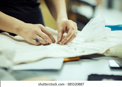 Professional seamstress at work. - Powered by Shutterstock