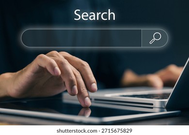 A professional searches on a digital interface using a laptop and tablet, representing online search engines, information retrieval, data discovery, SEO research, and digital marketing analysis.