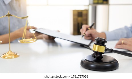 Professional Secretary Lawyer Working At His Office Signing Contract Consultation Of Client From Trust Law Firm, Attorneys Notary Law And Legal Services Concept.