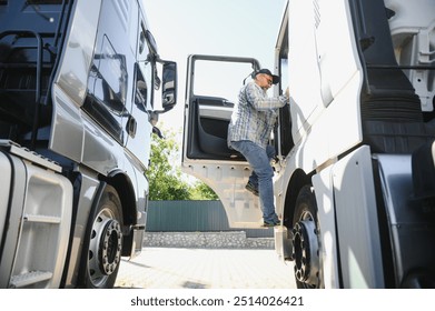 Professional Semi Truck Driver Behind the Wheel of a Classic Truck. - Powered by Shutterstock