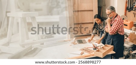 Professional senior carpenter man working with women team design wooden furniture in wood workshop in factory wide for advertising banner background.