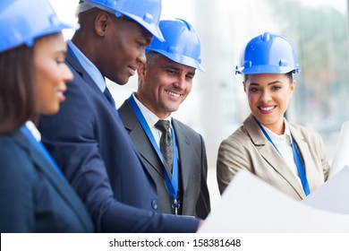 Professional Senior Construction Manager Working With Team