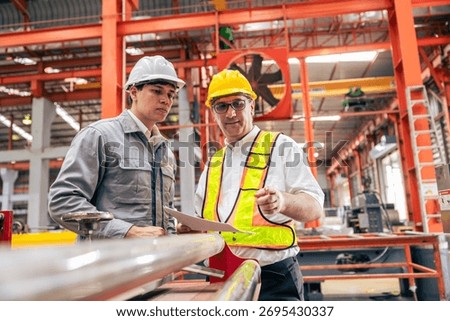 Professional senior engineer training, Two workers working, Technician supervisor man work with young engineer in steel metal industry manufacture factory plant.