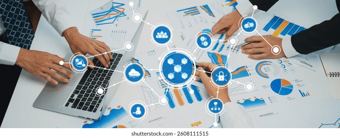 A professional setting showcasing teamwork and analysis of business data, featuring charts, graphs, and laptops, highlighting collaboration and strategic insights. Amity