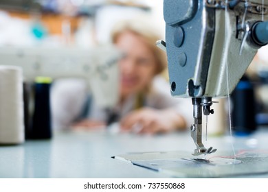professional sewing machine close up with needle and thread in it 
