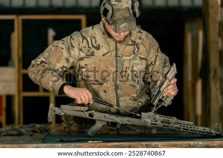 at professional shooting range at a range on a tree stand a trainer gives instructions on assembling a cleaned American machine gun demonstration of skills