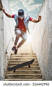 Professional Skateboarder Boy Jumps Off The Stairs