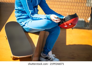 Professional Skateboarder Preparing For The Outdoor Workout