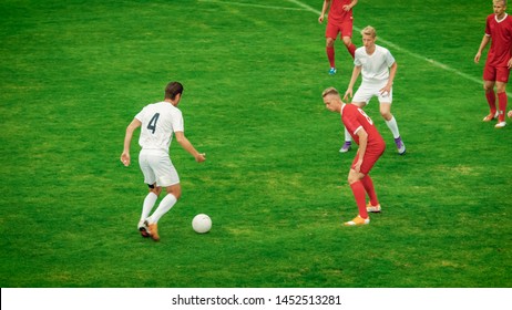 Professional Soccer Players Playing Pass Trying To Score A Goal. Impressive Professional Match On International Championship.