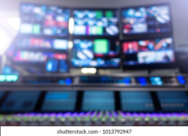 Professional Sound Engineer's Console. Television Broadcast, Working With Video And Audio Mixer, Control Broadcast In Recording Studio. Blurred Background, Monitors