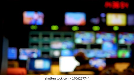 Professional sound engineer's console. Television Broadcast, working with video and audio mixer, control broadcast in recording studio. blurred background, monitors.