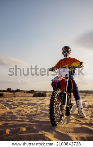 Professional speed rider driving in motocross race