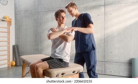 Professional Sport Physiotherapist Working On Specific Muscle Groups And Back Pain With Young Male Athlete. Sportsman Recovering From Mild Injury. Trauma Prevention Therapy And Rehabilitation.