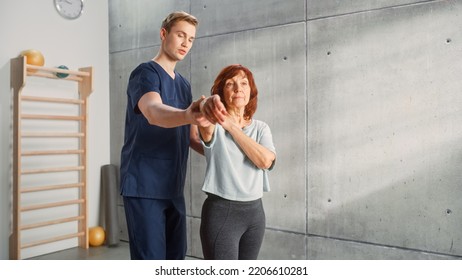 Professional Sport Physiotherapist Working on Specific Muscle Groups and Back Pain with Middle Aged Sporty Female. Senior Woman Treating Mild Injury. Trauma Prevention Therapy, Rehabilitation. - Powered by Shutterstock