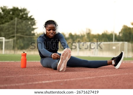 Professional sprinter runner warming up before running training.