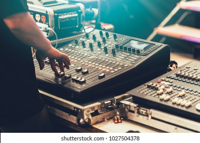 Professional Stage Sound Mixer Closeup At Sound Engineer Hand Using Audio Mix Slider Working During Concert Performance