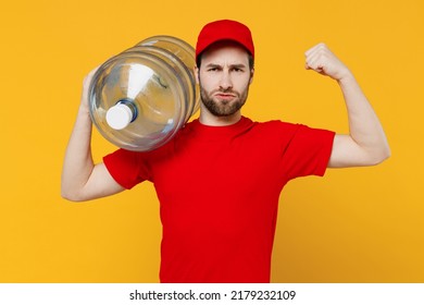 Professional Strong Delivery Guy Employee Man In Red Cap T-shirt Uniform Workwear Work As Dealer Courier Hold Water Bottle Show Show Muscles Isolated On Plain Yellow Background Studio. Service Concept