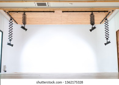 The Professional Studio Hall Hang The LED Light Form Wood Ceiling With The Infinity White Wall Behind.