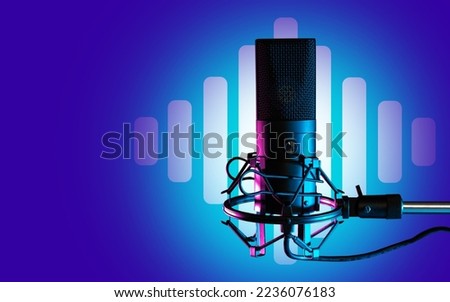 Professional studio microphone close up. Condenser microphone on blue. Device for podcasting. Microphone symbol recording audio podcasts. Studio equipment for audio podcasts. Singing, voice, sound