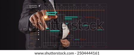 A professional in a suit interacts with a digital construction management interface, adjusting a project timeline displayed on a transparent virtual screen