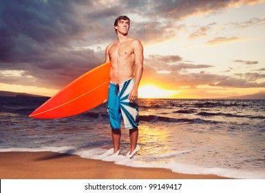 Professional Surfer Holding A Surf Board