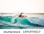 professional surfer riding waves in Bali, Indonesia. men catching waves in ocean, isolated. Surfing action water board sport. people water sport lessons and beach swimming activity on summer vacation