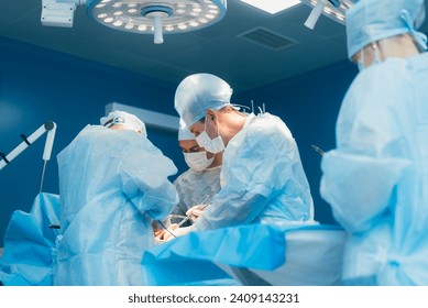 Professional surgeons performing surgery in hospital - Powered by Shutterstock