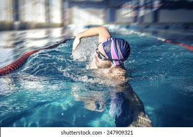 Professional Swimmer Crawl Freestyle In A Swimming Pool