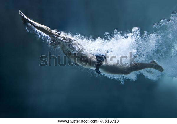 professional swimmer\
underwater after the\
jump