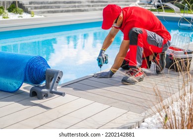 Professional Swimming Pools Worker Finishing Composite Outdoor Pool Deck Installation. SPA Industry Theme. - Shutterstock ID 2202142881