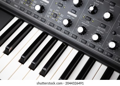 Professional Synthesizer Piano Keyboard And Volume Regulators. Modern Analog Synth For Electronic Music Production In Sound Recording Studio 