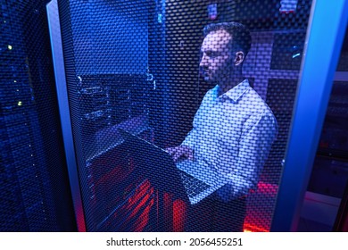 Professional system administrator maintaining data security in colocation center