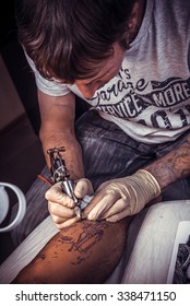 Professional Tattooer Makes Cool Tattoo In Tatoo Salon