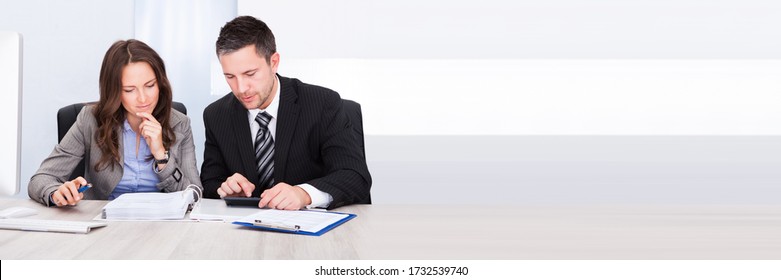 Professional Tax Accountant Woman And Man At Desk