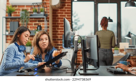 Professional team of developers working with 3d graphics software, brainstorming new ideas. Man and woman colleagues using artificial intelligence to create digital project at job.