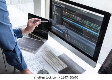 Professional Team Of Programmer Working On Project In Software Development Computer In IT Company Office, Writing Codes And Data Code Website And Coding Database Technologies On New Application.