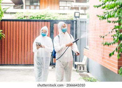 Professional teams for disinfection worker in protective mask and white suit disinfectant spray cleaning virus for help service kill coronavirus at customer home - Shutterstock ID 2066641010