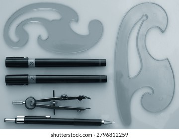 Professional Technical Drawing Tools Layout with French Curves and Precision Pens for Engineering Design   